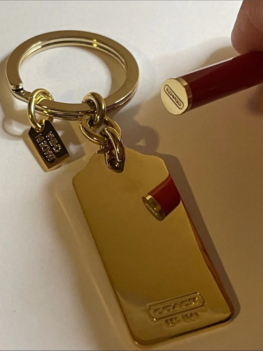 Coach gold tone
